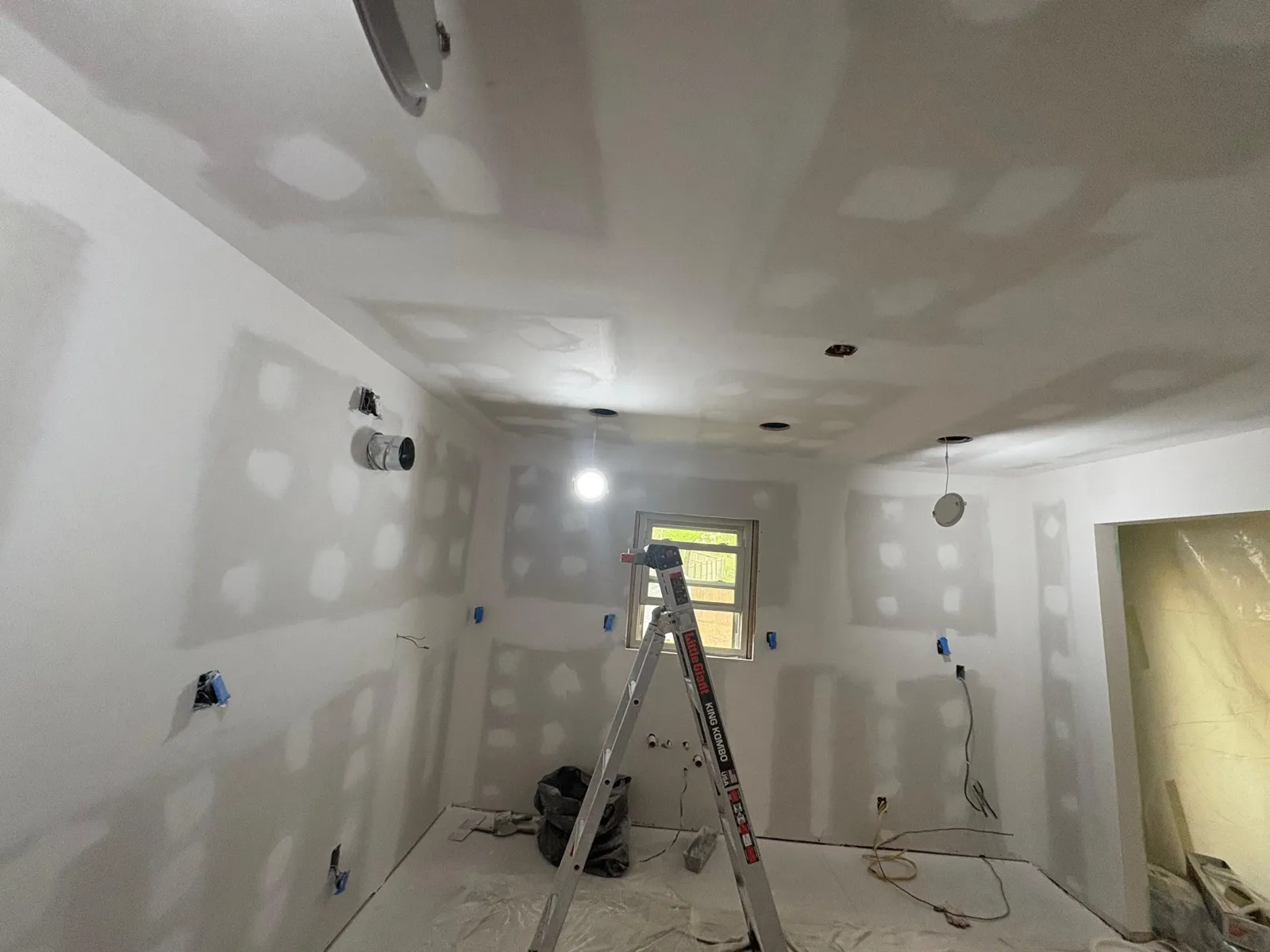 Freshly mudded drywall in a residential interior