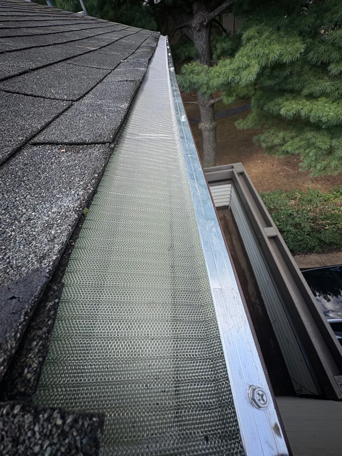Newly installed gutter guards on residential roof