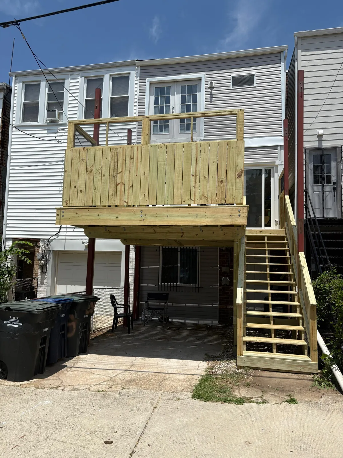 New pressure-treated wood deck with stairs
