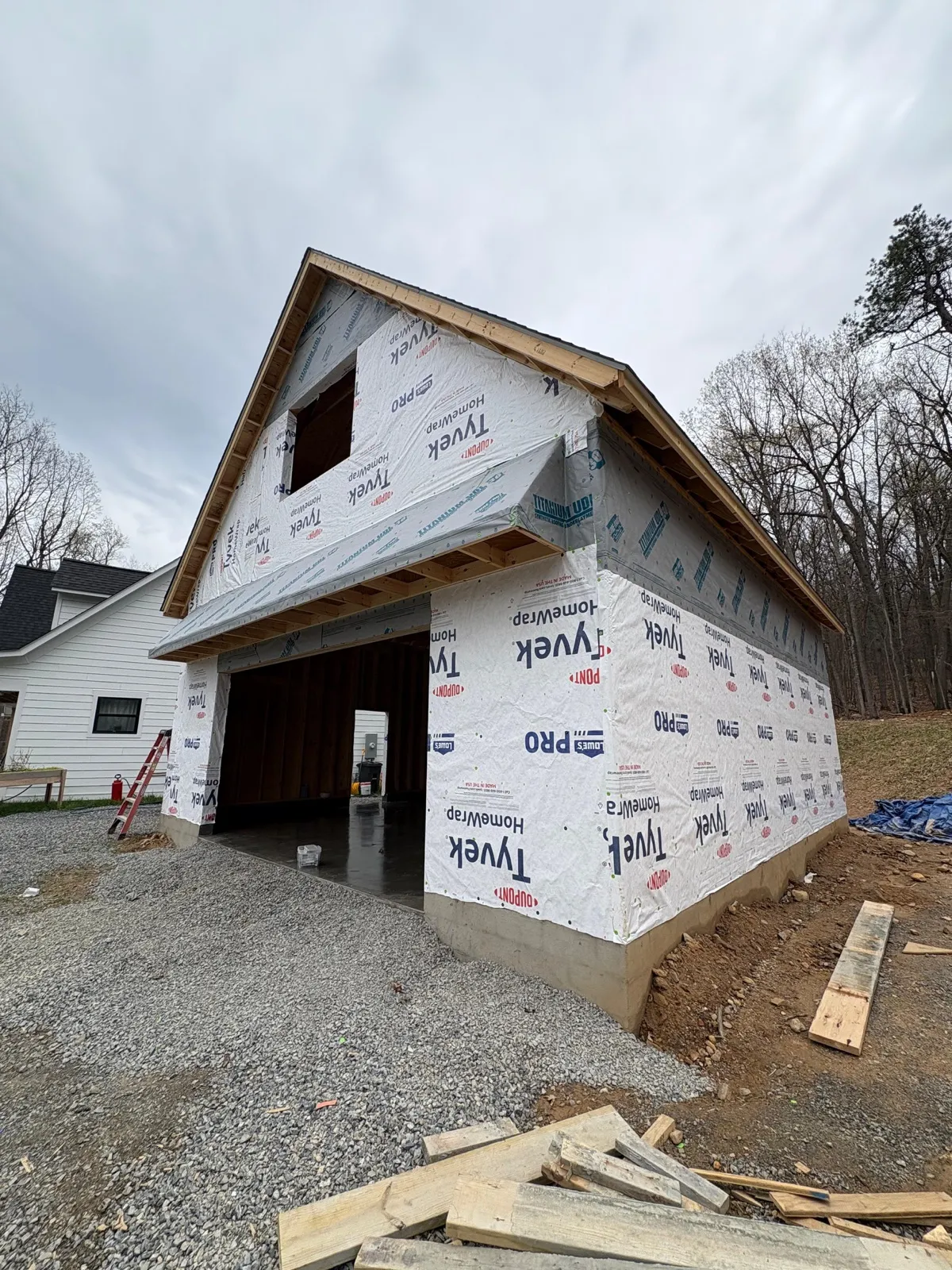Detached garage under construction with Tyvek wrap