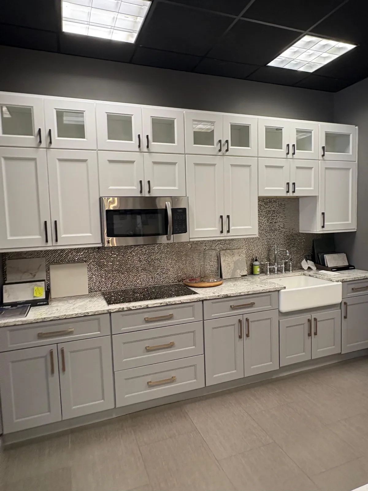 White shaker cabinets with quartz countertops