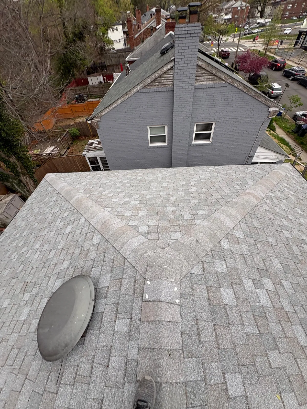 Asphalt shingle roof aerial view with proper ridge alignment