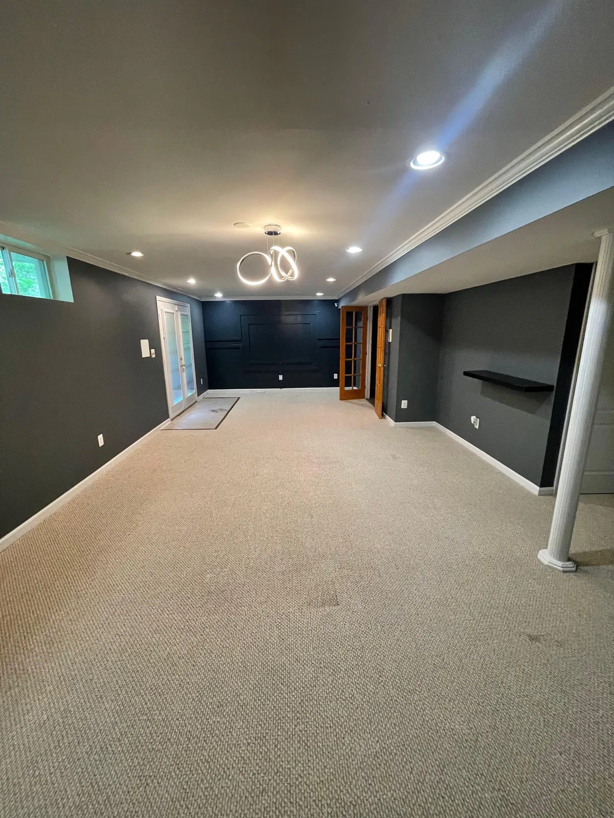 Finished basement with carpet and recessed lighting