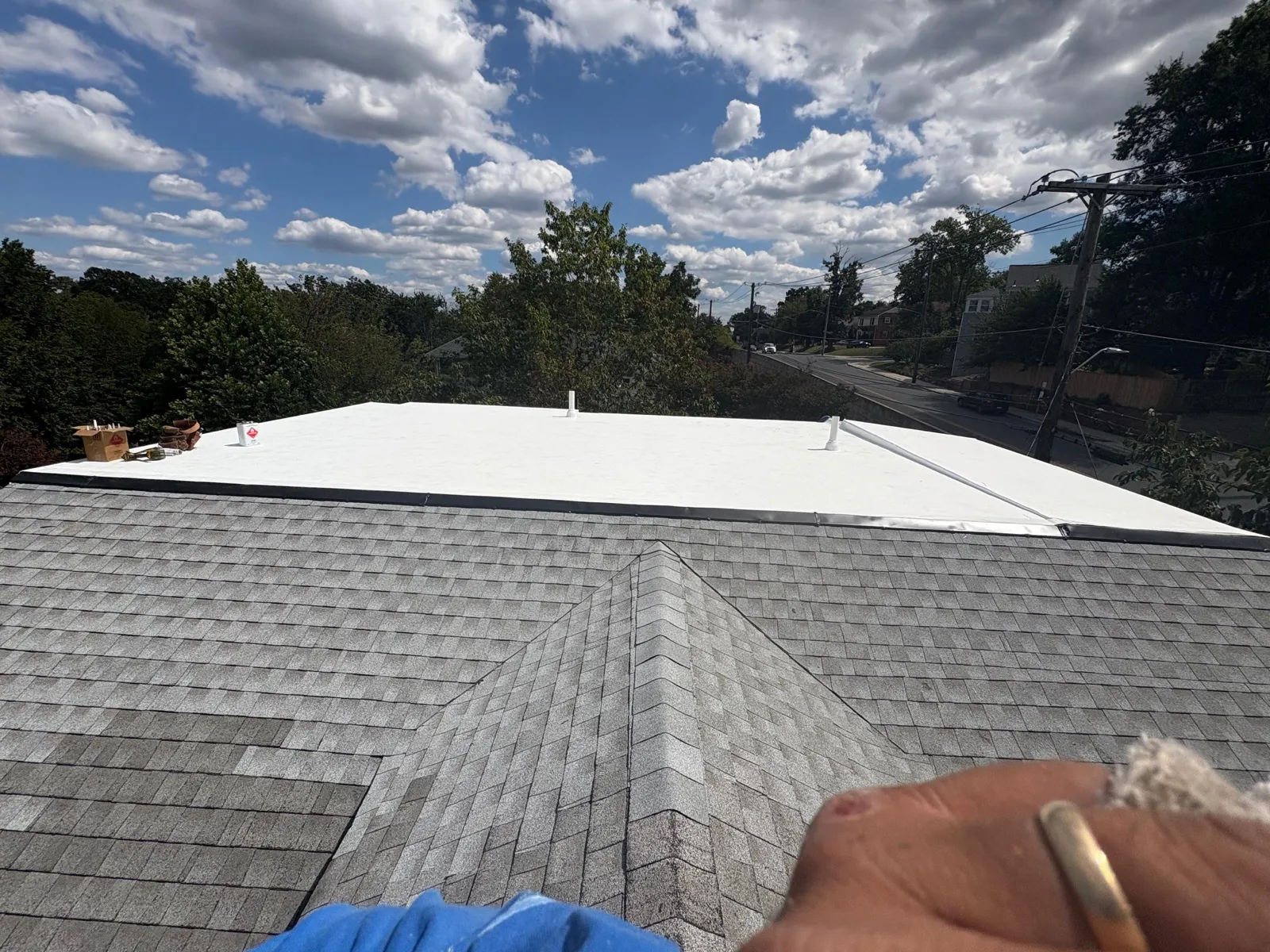 TPO flat section transitioning into shingle roof