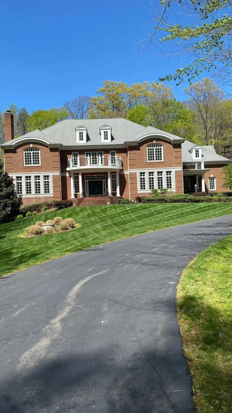 Premium brick home with custom roofing and exterior