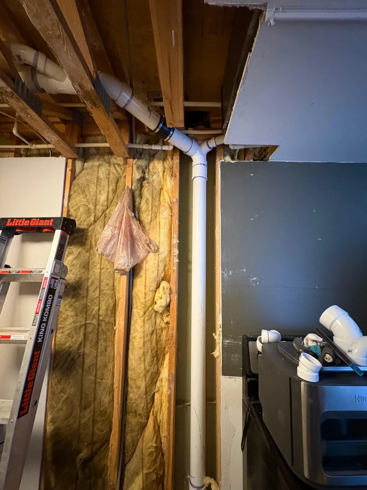 Insulation and plumbing rough-in during interior remodel
