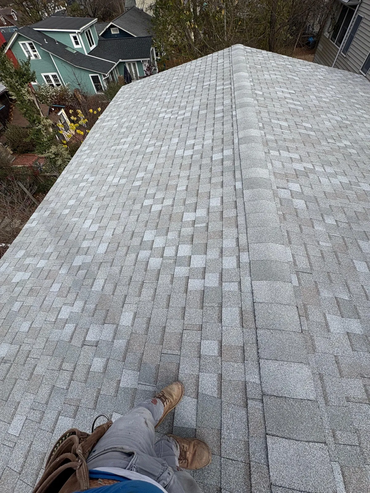 Top-down view of asphalt shingle installation