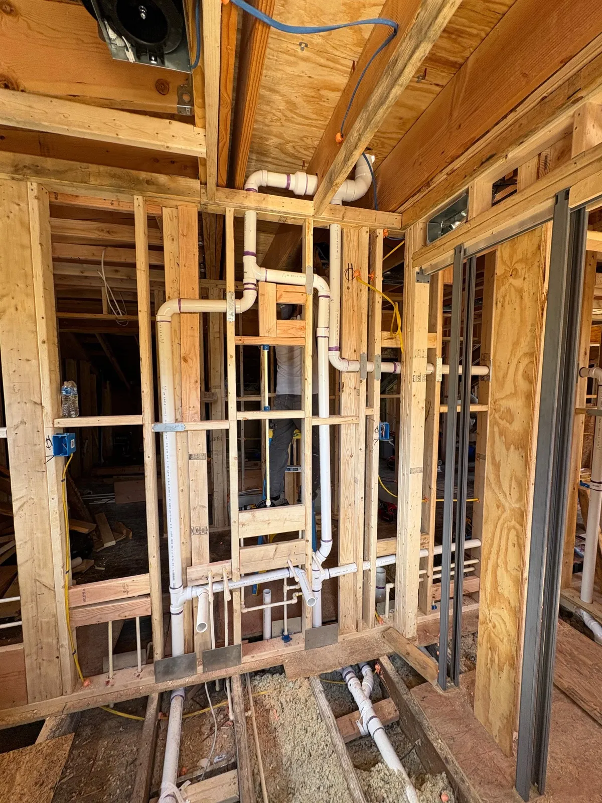 Framing and plumbing rough-in for interior addition