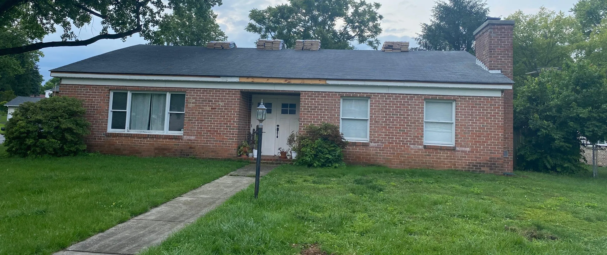 Brick rancher with a new dark asphalt shingle roof
